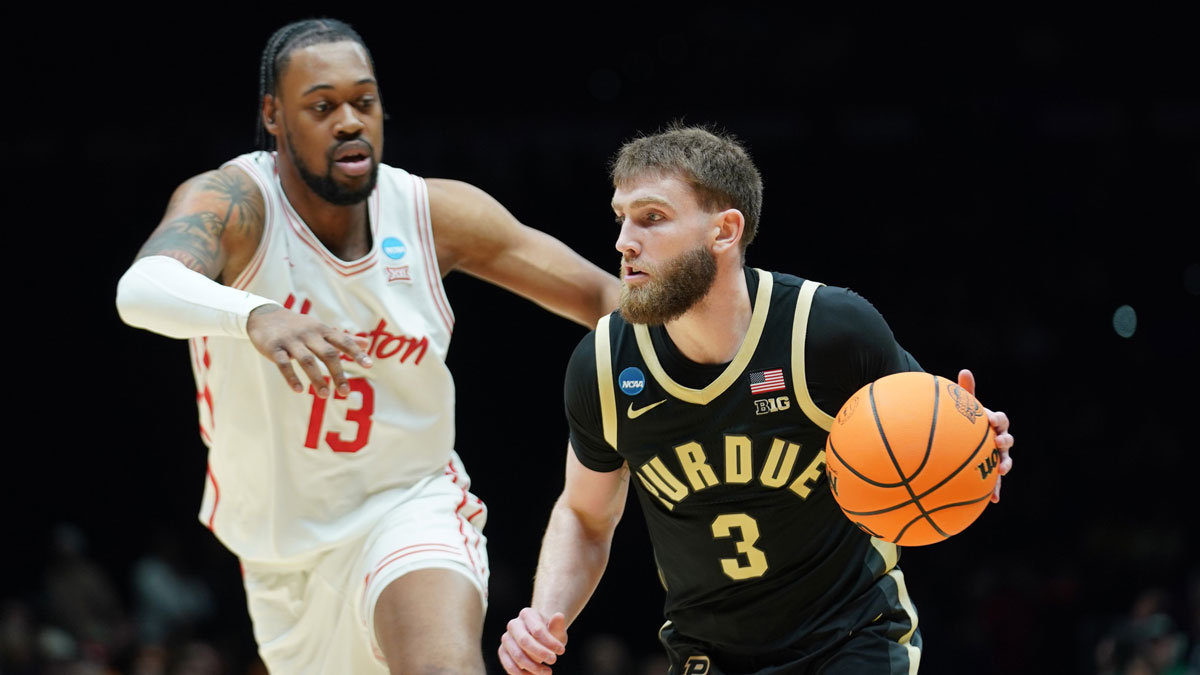 Purdue Boilermakers guard Braden Smith (3) dribbles the ball past Houston Cougars forward J'Wan Roberts (13) in the first half during a Midwest Regional semifinal of the 2025 NCAA tournament at Lucas Oil Stadium.