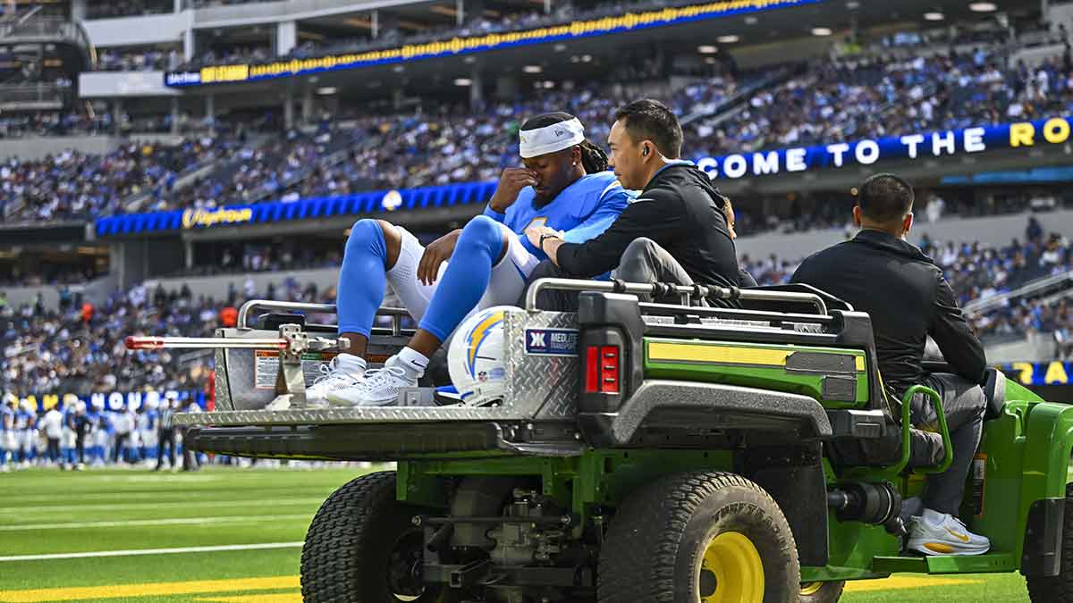 Aug 16, 2025; Inglewood, California, USA; Los Angeles Chargers wide receiver Quentin Johnston (1) reacts after being driven away with an injury against the Los Angeles Rams during the first quarter at SoFi Stadium.