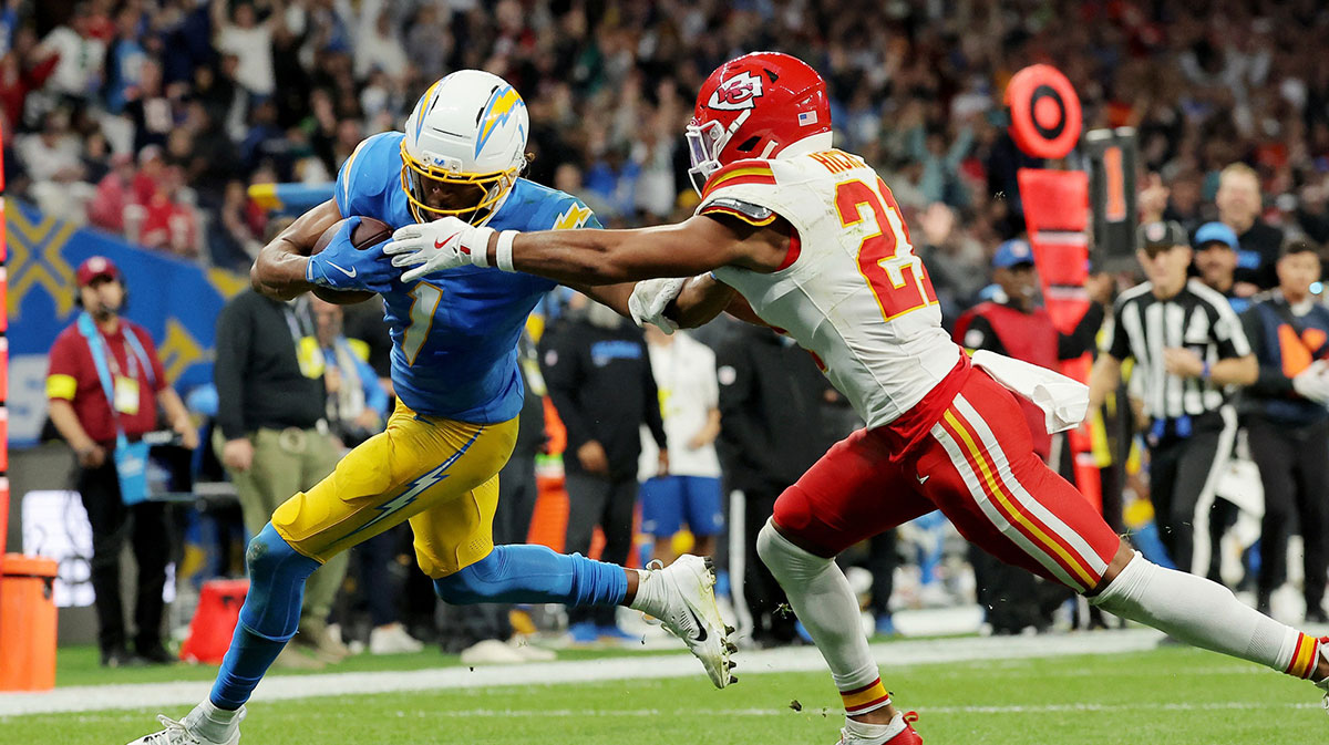 Los Angeles Chargers wide receiver Quentin Johnston (1) runs against Kansas City Chiefs safety Jaden Hicks (21) before scoring a touchdown in the second half during a NFL game at Corinthians Arena. 