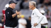 Las Vegas Raiders offensive coordinator Chip Kelly (left) with head coach Pete Carroll against the Arizona Cardinals during a preseason NFL game at State Farm Stadium.