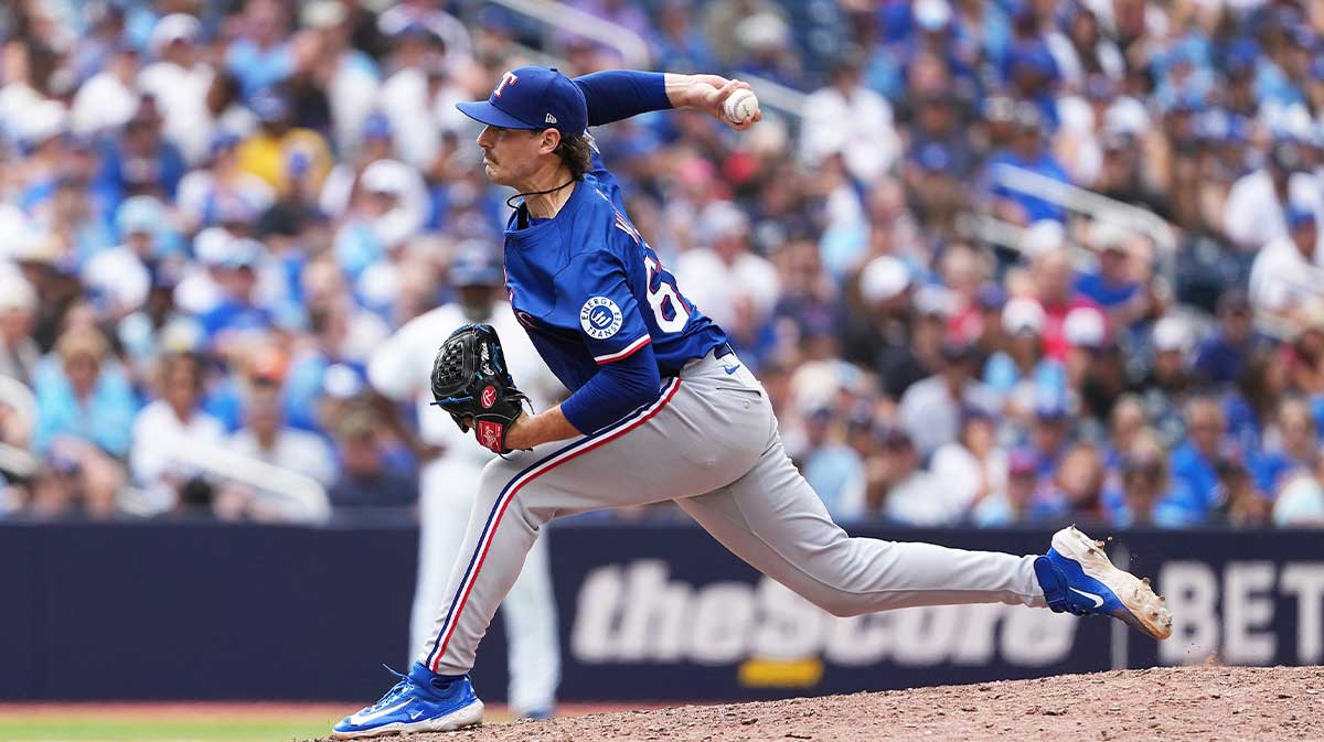 Texas Rangers pitcher Cole Winn (60) throws a pitch against the Toronto Blue Jays during the eighth inning at Rogers Centre.