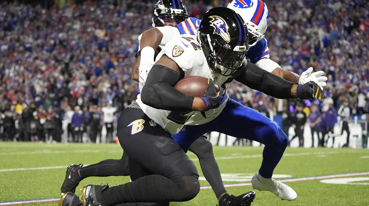 Baltimore Ravens running back Derrick Henry (22) is tackled by Buffalo Bills cornerback Dorian Strong (43) during the second quarter at Highmark Stadium.