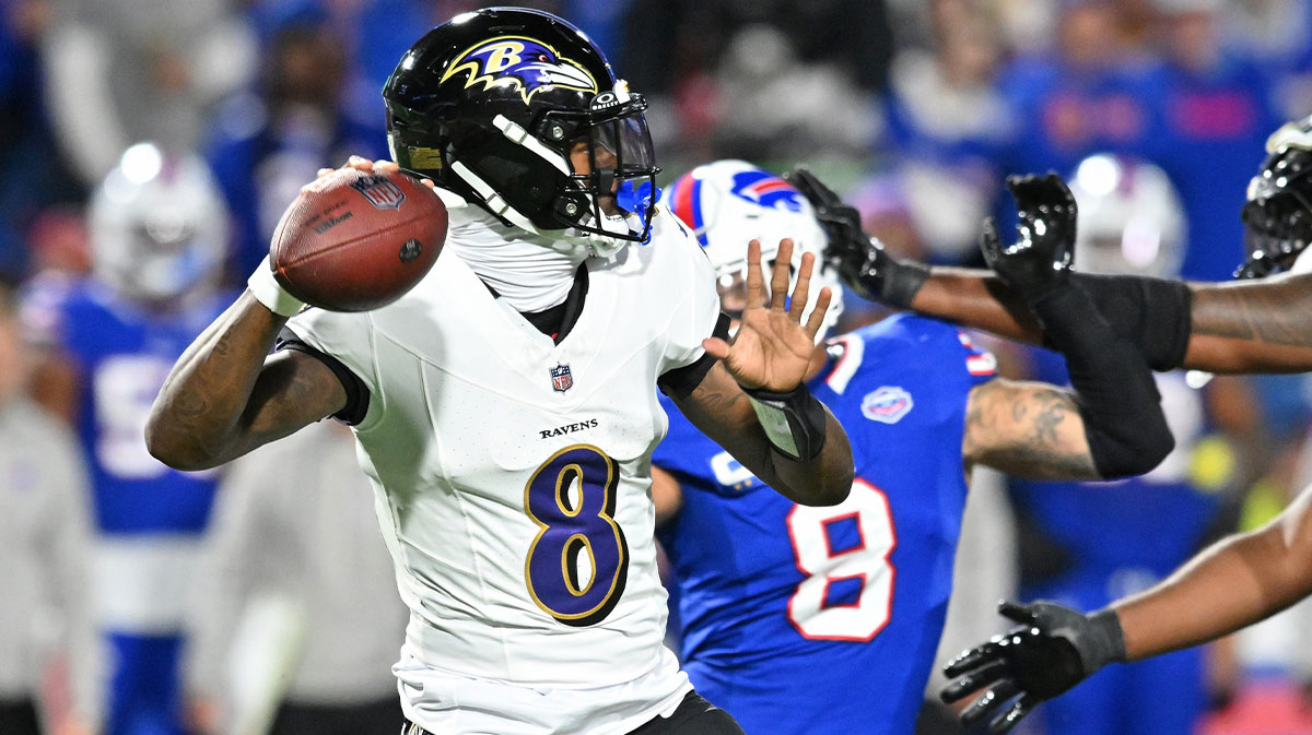 Baltimore Ravens quarterback Lamar Jackson (8) passes the ball against the Buffalo Bills during the first half at Highmark Stadium.