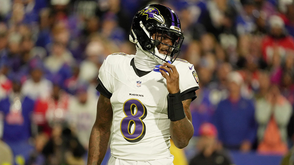 Ravens quarterback Lamar Jackson looks down field before everyone lines up during first half action against the Baltimore Ravens at Highmark Stadium in Orchard Park on Sept. 7, 2025 with Bills logo in the background