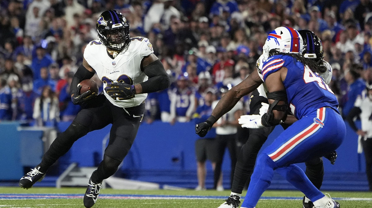 Baltimore Ravens running back Derrick Henry (22) runs the ball for a touchdown during the second quarter against the Buffalo Bills at Highmark Stadium.