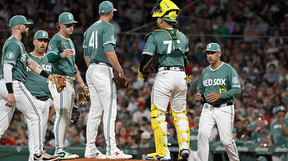 Boston Red Sox manager Alex Cora (13) goes to the mound to relieve relief pitcher Steven Matz (41) of the ball during the fifth inning against the Detroit Tigers at Fenway Park.