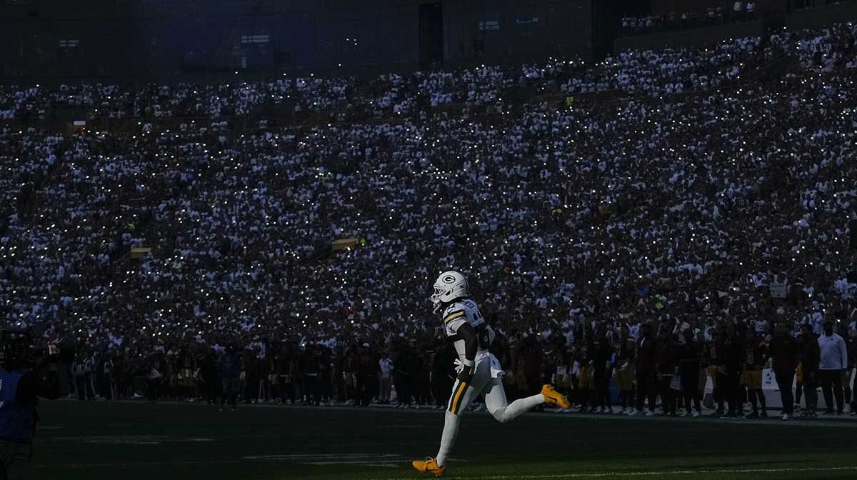 Green Bay Packers wide receiver Jayden Reed (11) runs onto the field prior to the game against the Washington Commanders at Lambeau Field.