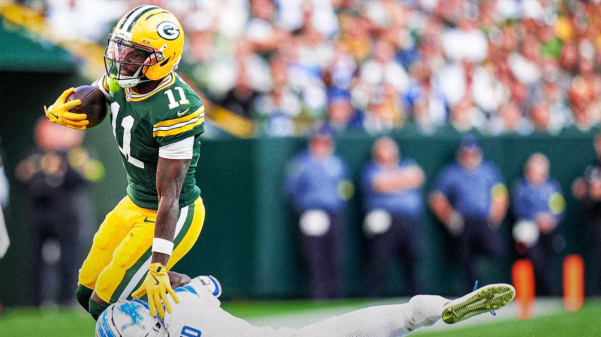 Detroit Lions cornerback D.J. Reed (4) tackles Green Bay Packers wide receiver Jayden Reed (11) during the second half at Lambeau Field in Green Bay, Wis., on Sunday, September 7, 2025.