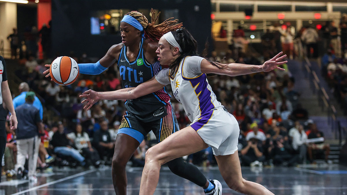 Atlanta Dream guard Rhyne Howard (10) reaches for the ball against Los Angeles Sparks forward Dearica Hamby (5) during the third quarter at Gateway Center Arena at College Park.