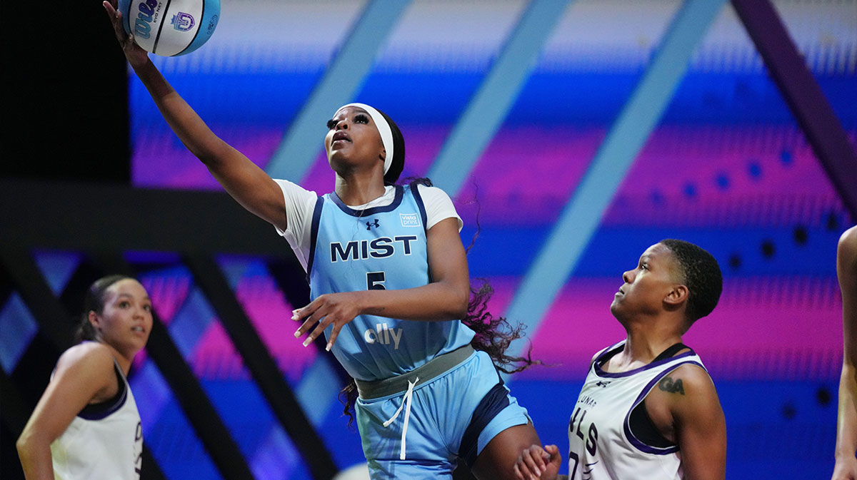 Rickea Jackson (5) of the Mist drives to the basket past Courtney Williams (10) of the Lunar Owls during the second half of the Unrivaled women’s professional 3v3 basketball league at Wayfair Arena. 