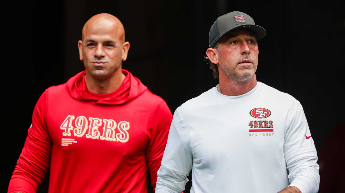 San Francisco 49ers defensive coordinator Robert Saleh, left, and head coach Kyle Shanahan, right, exit the locker room during pregame warmups against the Seattle Seahawks at Lumen Field.