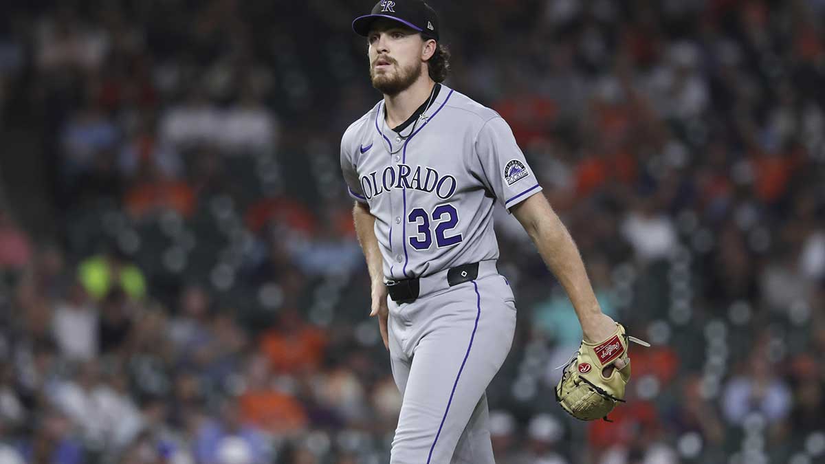 Colorado Rockies starting pitcher Chase Dollander (32) reacts after issuing a walk during the fifth inning against the Houston Astros at Daikin Park.