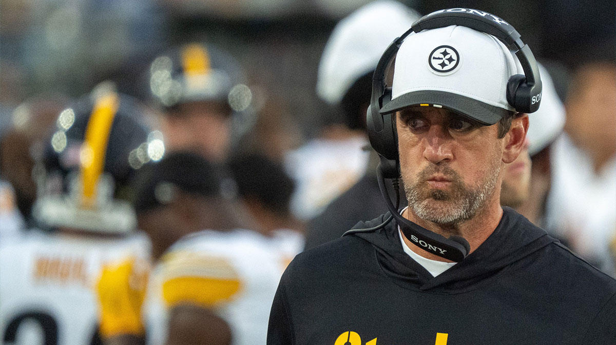 Pittsburgh Steelers quarterback Aaron Rodgers (8) walks along the sideline with a head set during the first half of the first preseason game where the Jacksonville Jaguars hosted the Pittsburgh Steelers Saturday Aug. 9, 2025, at EverBank Stadium in Jacksonville, Fla.