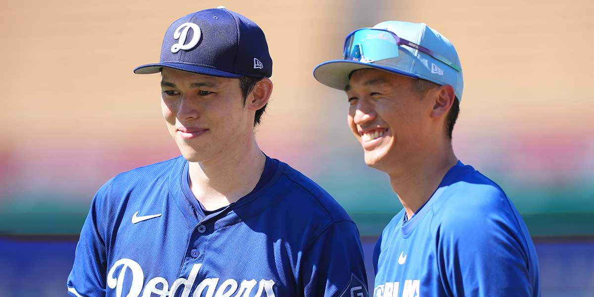 Aug 8, 2025; Los Angeles, California, USA; Los Angeles Dodgers pitcher Roki Sasaki (left) poses with former Toronto Blue Jays player Gosuke Katoh at Dodger Stadium.