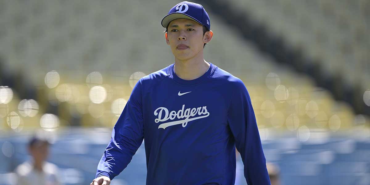 Los Angeles Dodgers starting pitcher Roki Sasaki (11) walks on the field prior to the game against the Los Angeles Dodgers at Dodger Stadium.