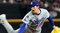 Los Angeles Dodgers pitcher Roki Sasaki throws against the Arizona Diamondbacks in the seventh inning at Chase Field.