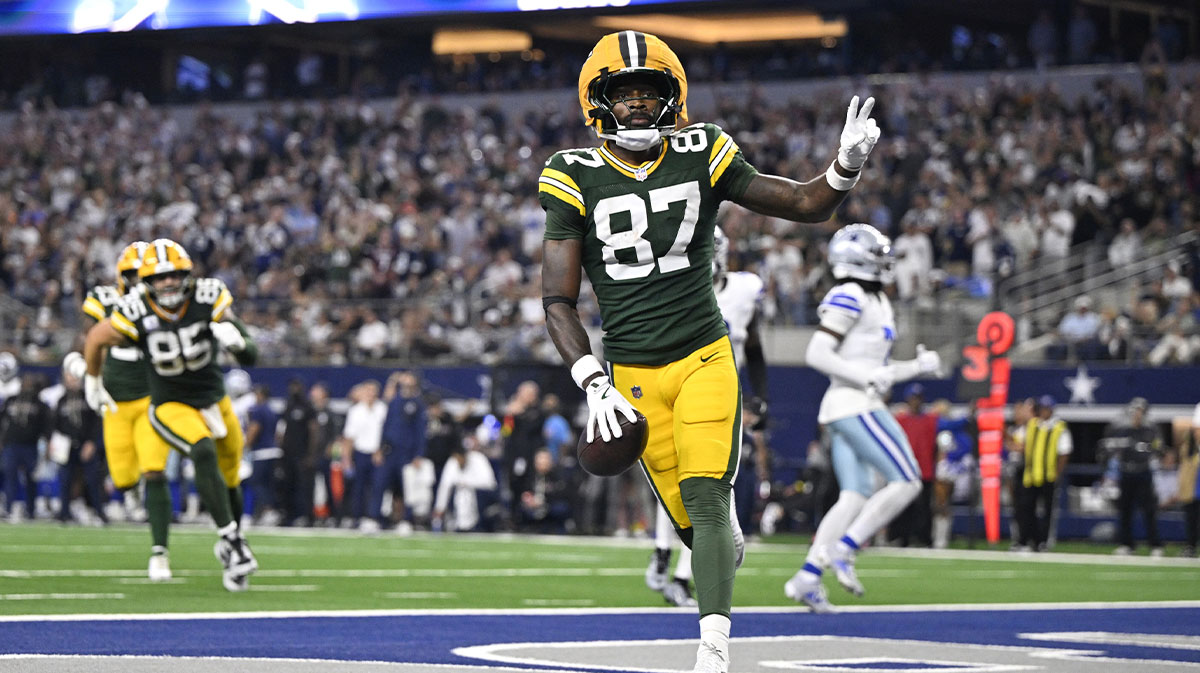 Green Bay Packers wide receiver Romeo Doubs (87) celebrates after scoring a touchdown against the Dallas Cowboys in the fourth quarter at AT&T Stadium.