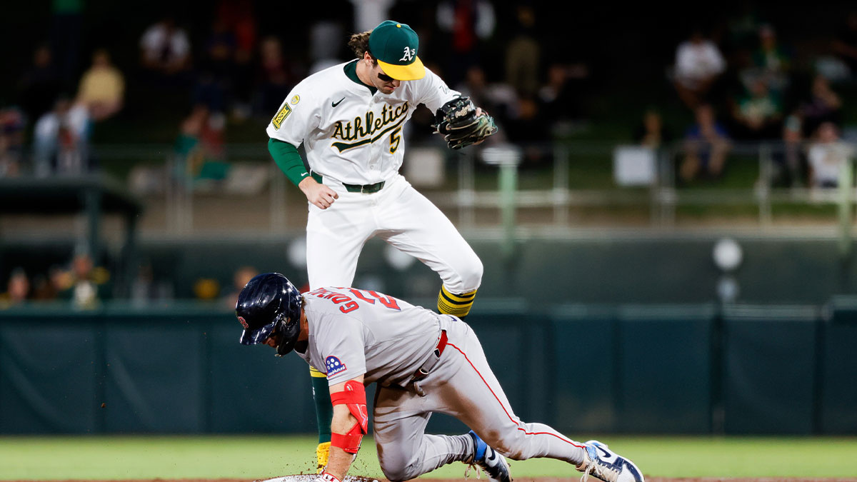 Boston Red Sox first baseman Romy Gonzalez (23) slides into second base after hitting an RBI double during the second inning against the Athletics at Sutter Health Park.