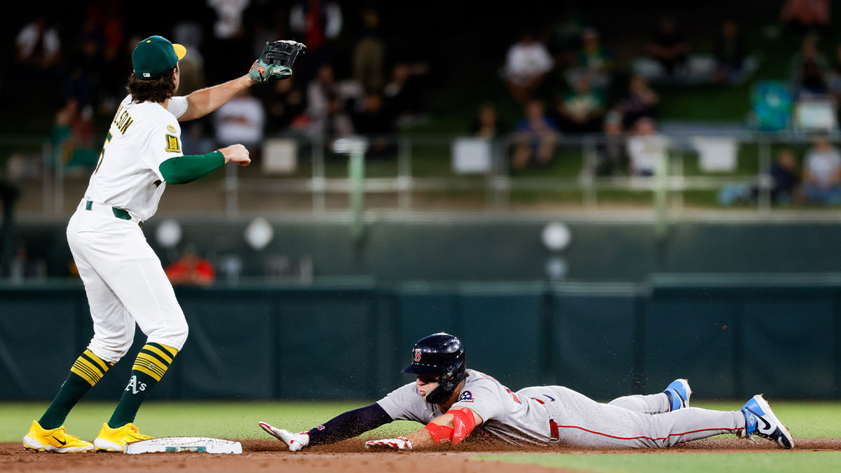 Boston Red Sox first baseman Romy Gonzalez (23) slides into second base after hitting an RBI double during the second inning against the Athletics at Sutter Health Park.