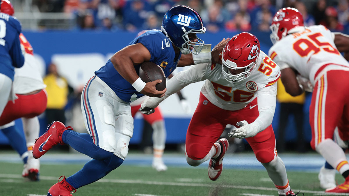 New York Giants quarterback Russell Wilson (3) runs against Kansas City Chiefs defensive end George Karlaftis (56) in the fourth quarter at MetLife Stadium.