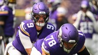 Minnesota, USA; Minnesota Vikings quarterback J.J. McCarthy (9) and center Ryan Kelly (78) warm up before the game against the Houston Texans at U.S. Bank Stadium.