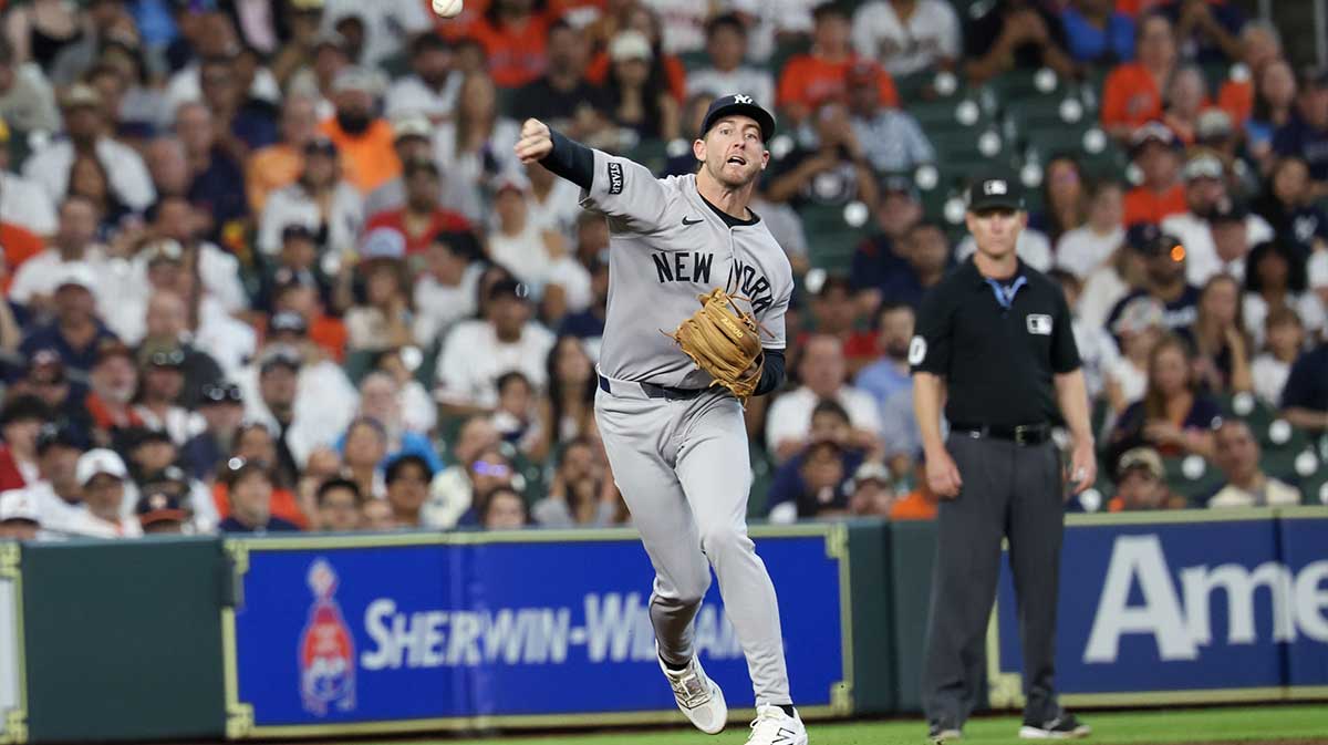 New York Yankees third baseman Ryan McMahon (19) throws Houston Astros third baseman Carlos Correa (1) (not pictured) out at first base in the first inning at Daikin Park.