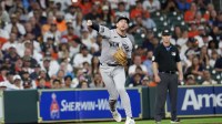 New York Yankees third baseman Ryan McMahon (19) throws Houston Astros third baseman Carlos Correa (1) (not pictured) out at first base in the first inning at Daikin Park.