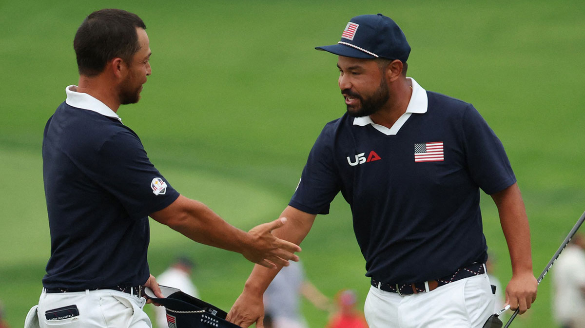 Team USA's J.J. Spaun and Xander Schauffele celebrate after winning the match on the 18th hole during the four-balls on the second day of competition for the Ryder Cup at Bethpage Black.