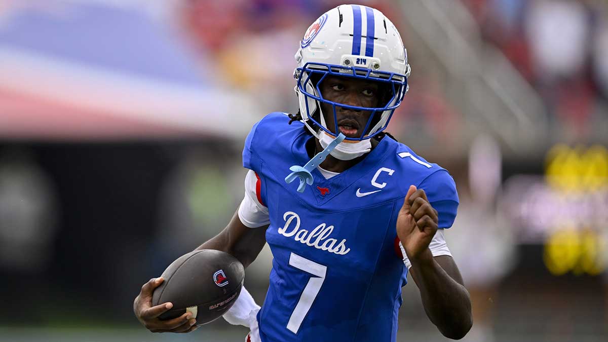 SMU Mustangs quarterback Kevin Jennings (7) runs with the ball during the game between the SMU Mustangs and the Baylor Bears at Gerald J. Ford Stadium.