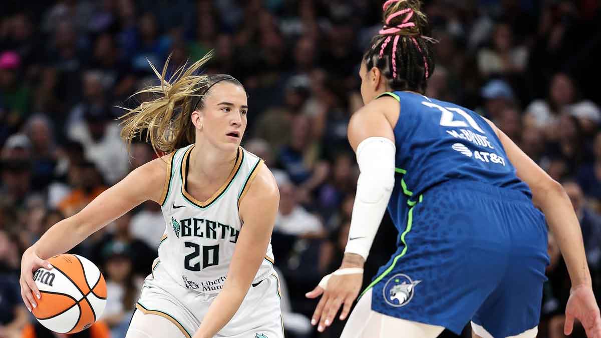 New York Liberty guard Sabrina Ionescu (20) works around Minnesota Lynx guard Kayla McBride (21) during the first quarter at Target Center.