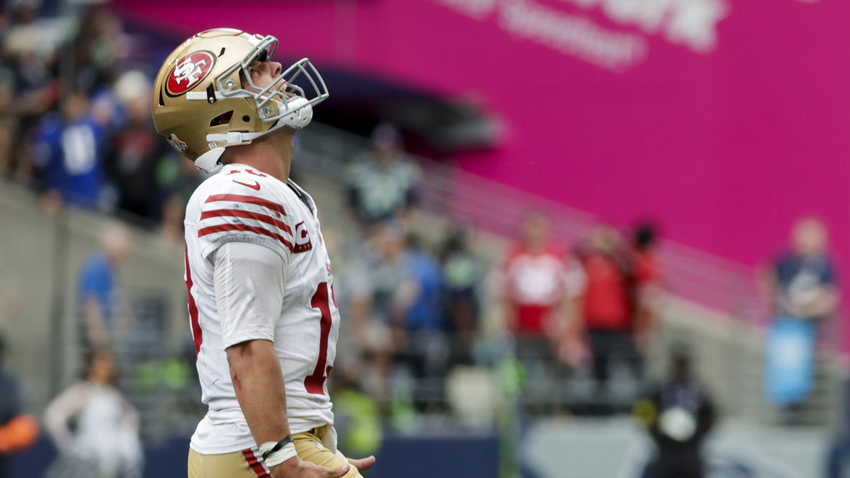 San Francisco 49ers quarterback Brock Purdy celebrates after throwing a touchdown pass against the Seattle Seahawks during the fourth quarter at Lumen Field.