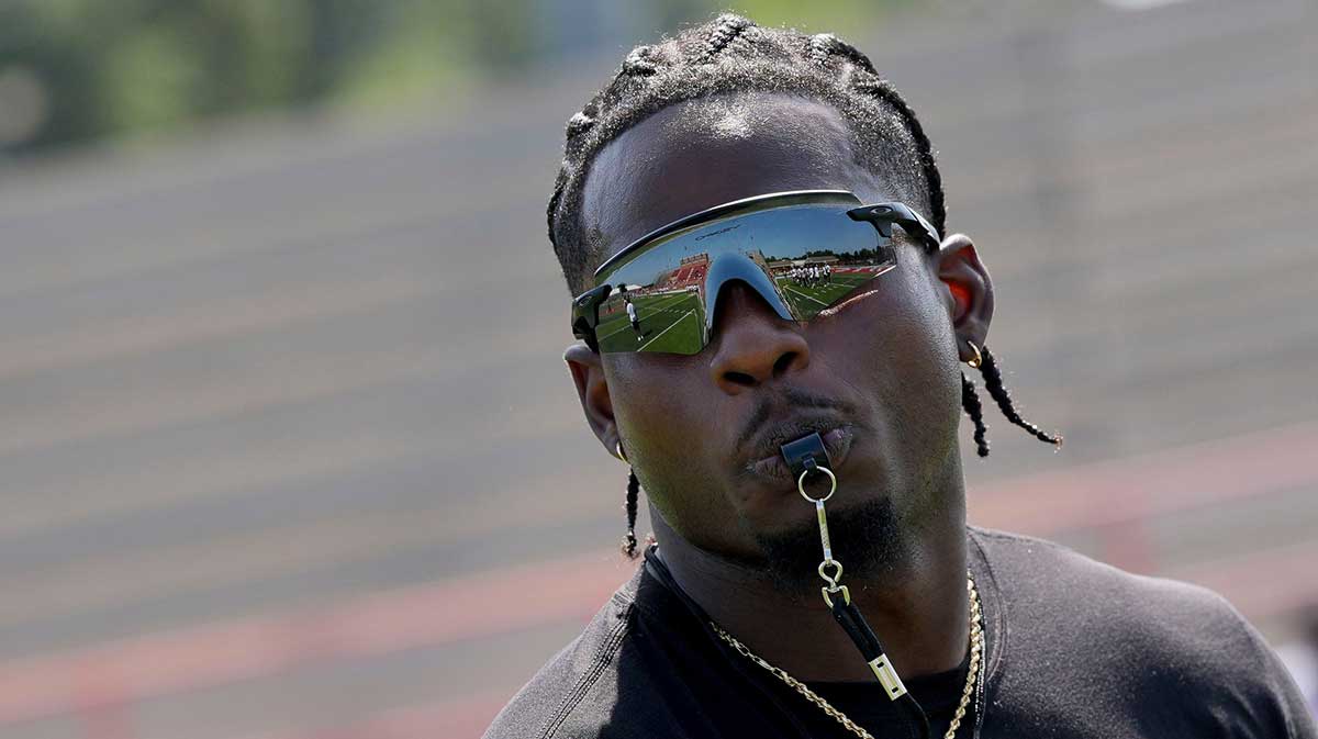 July 12, 2025; Tuscaloosa, AL, USA; NFL running back Brian Robinson Jr. blows the whistle to end a drill during the Brian Robinson Jr. Football Camp at Hillcrest High School. Robinson, a Hillcrest and University of Alabama alum, is a running back for the Washington Commanders.
