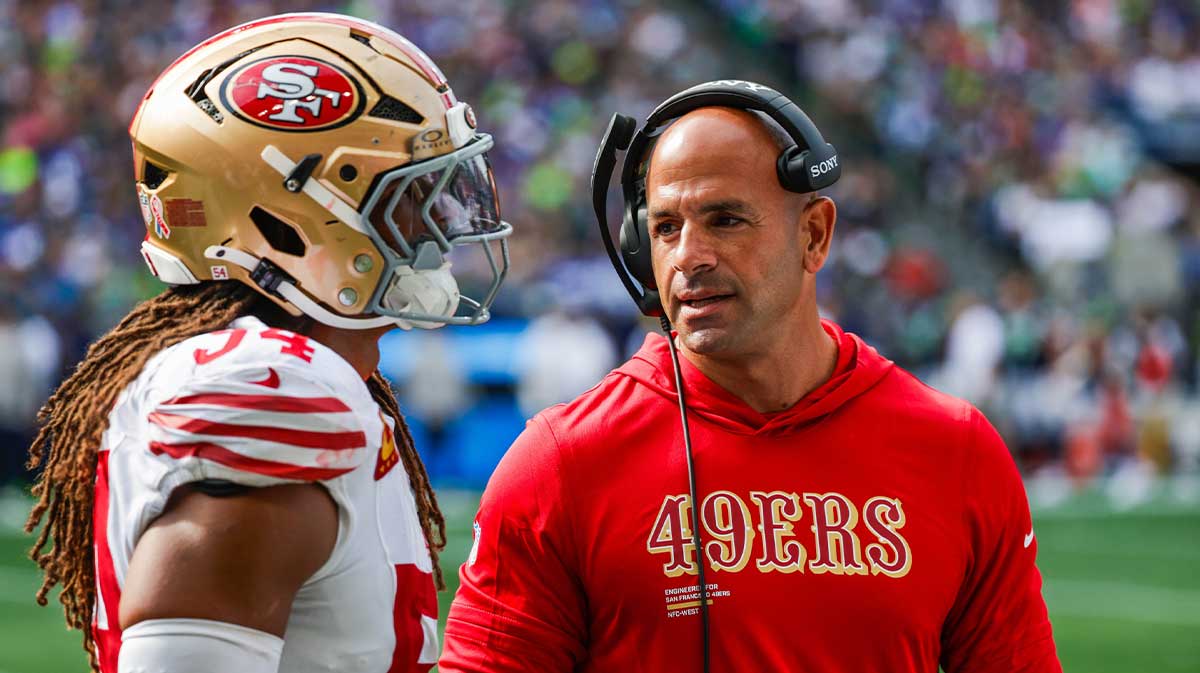 San Francisco 49ers defensive coordinator Robert Saleh talks with linebacker Fred Warner (54) during the fourth quarter against the Seattle Seahawks at Lumen Field.