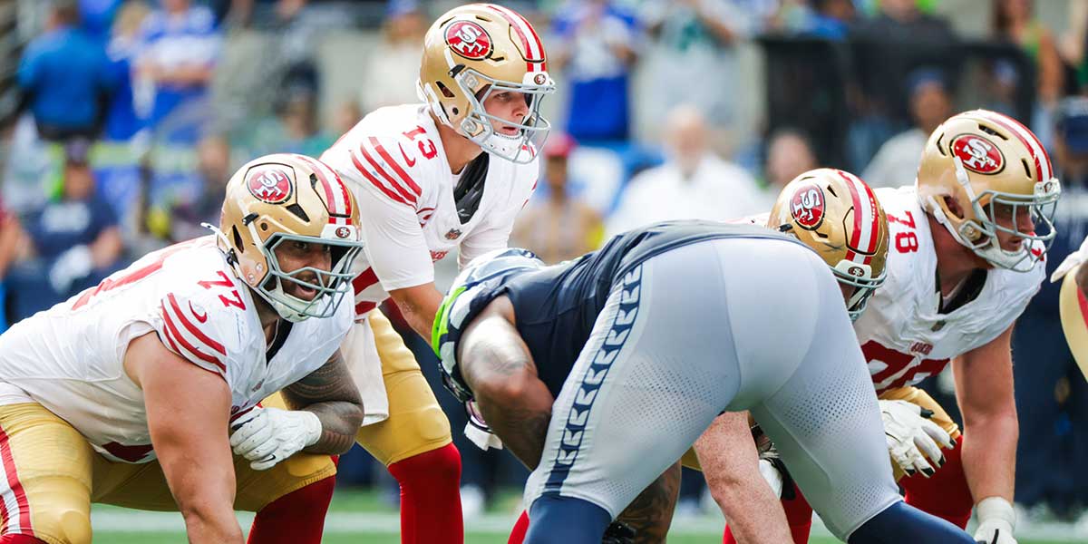 San Francisco 49ers quarterback Brock Purdy (13) stands over center during the third quarter against the Seattle Seahawks at Lumen Field.