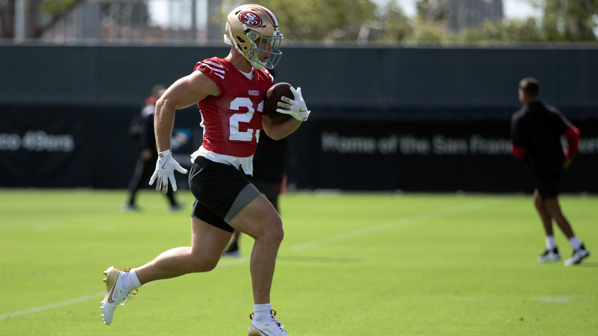 San Francisco 49ers running back Christian McCaffrey (23) runs a play during the first day of training camp at SAP Performance Facility.