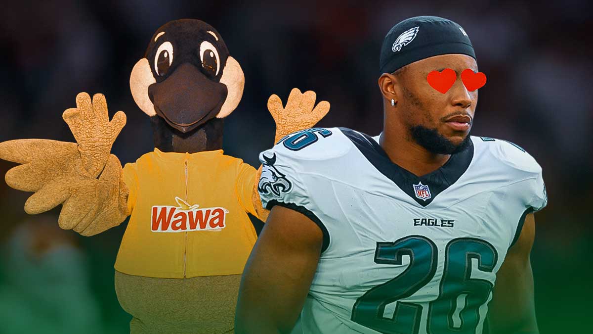 Saquon Barkley with hearts over his eyes next to the Wawa bird mascot in front of Lincoln Financial Field.