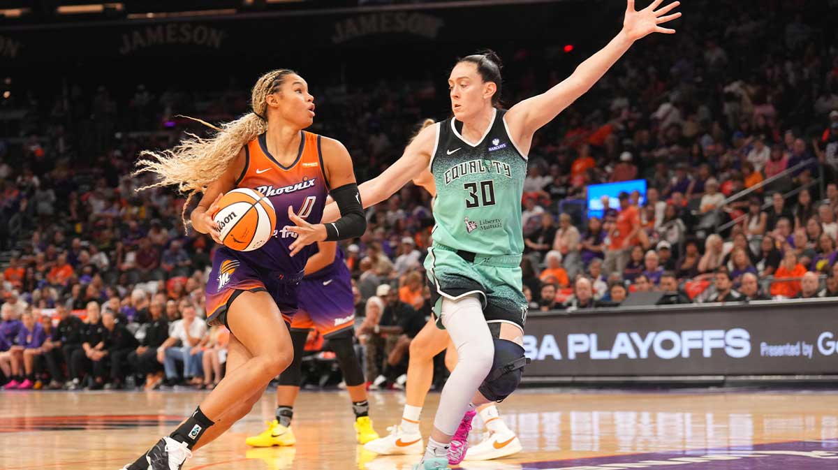 Phoenix Mercury forward Satou Sabally (0) dribbles against New York Liberty forward Breanna Stewart (30) during the second half of game three of round one for the 2025 WNBA Playoffs at PHX Arena.