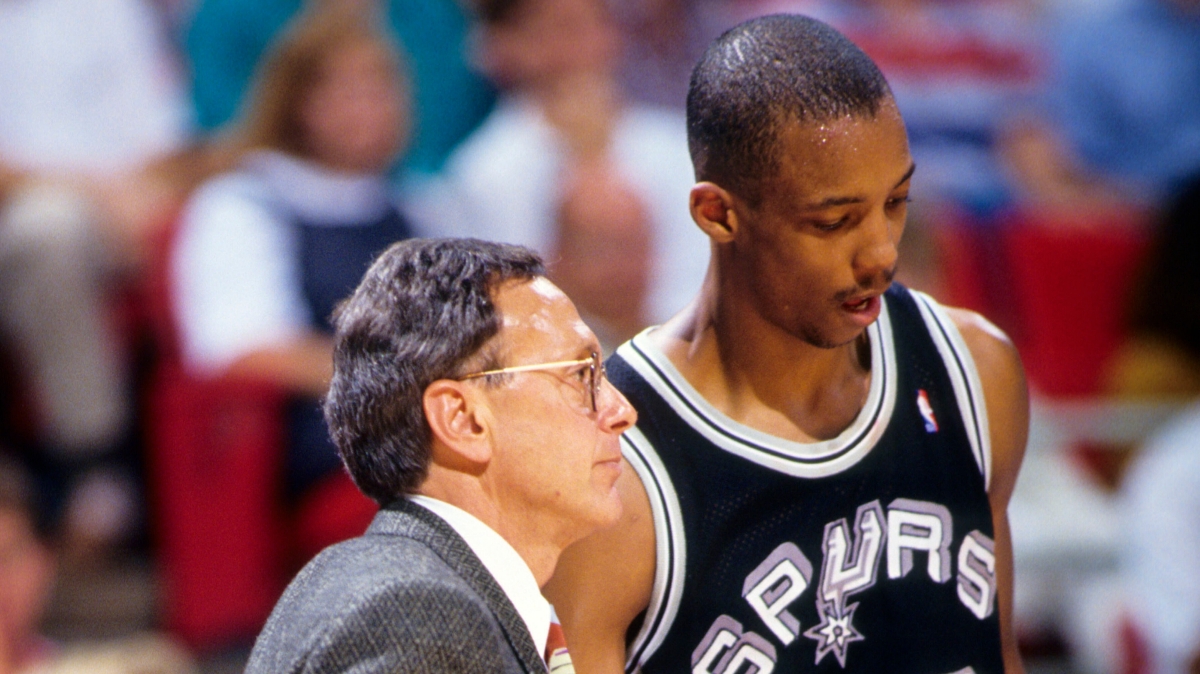 San Antonio Spurs head coach Larry Brown talks to guard Sean Elliott (32) against the Orlando Magic during the 1990-91 season at the Orlando Arena.