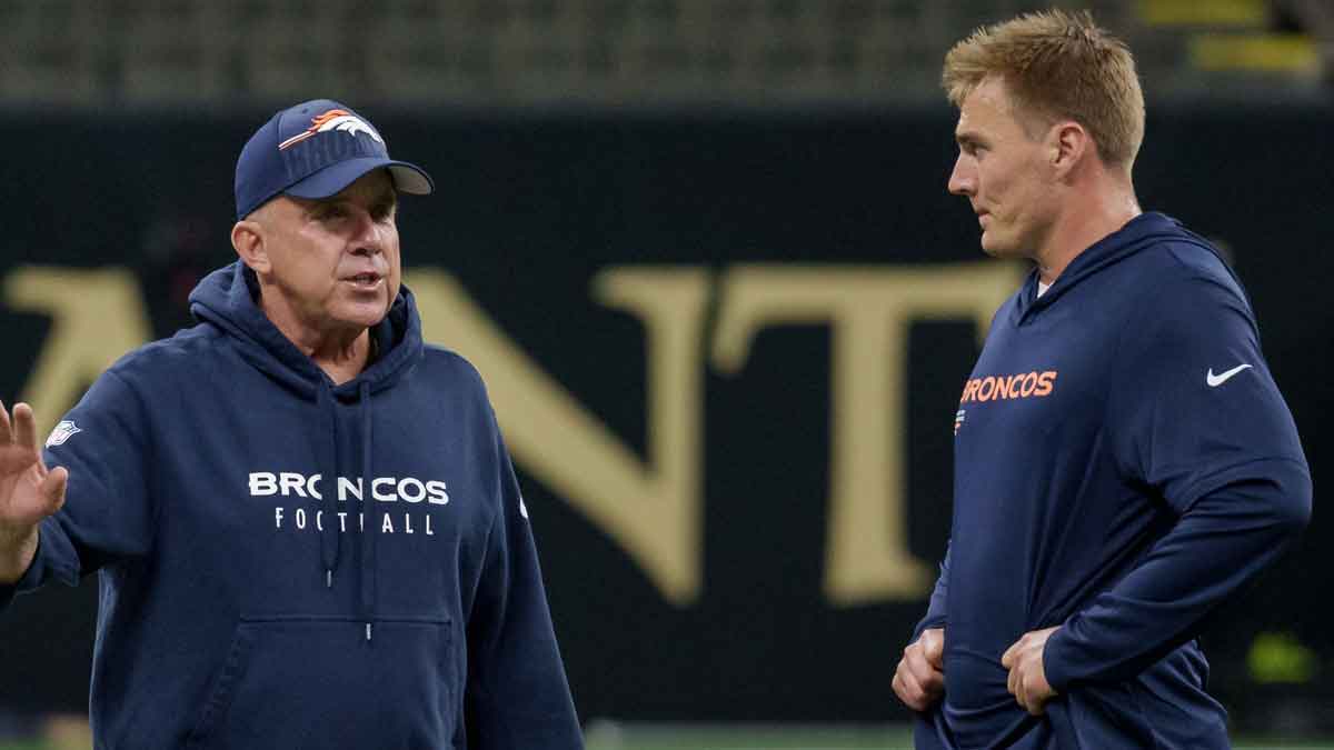 Denver Broncos head coach Sean Payton talks to Denver Broncos quarterback Bo Nix (10) before a game against the New Orleans Saints at Caesars Superdome.