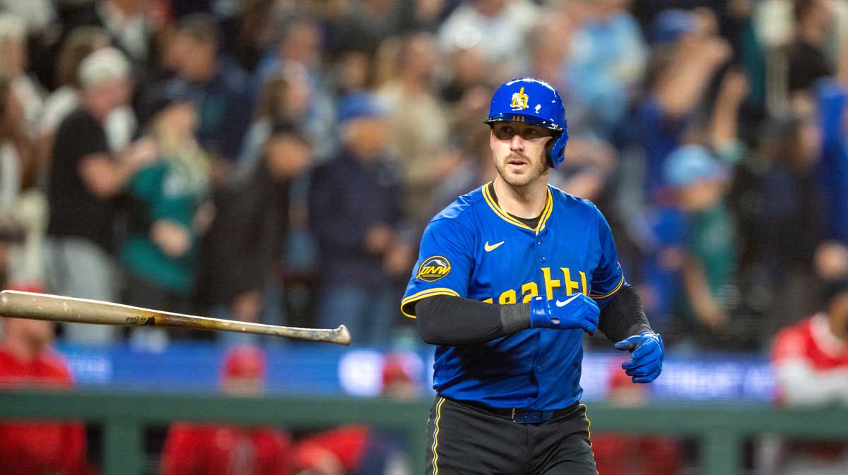 Sep 12, 2025; Seattle, Washington, USA; Seattle Mariners catcher Mitch Garver (18) flips his bat after hitting a solo home run during the seventh inning against the Los Angeles Angels at T-Mobile Park. Mandatory Credit: Stephen Brashear-Imagn Images