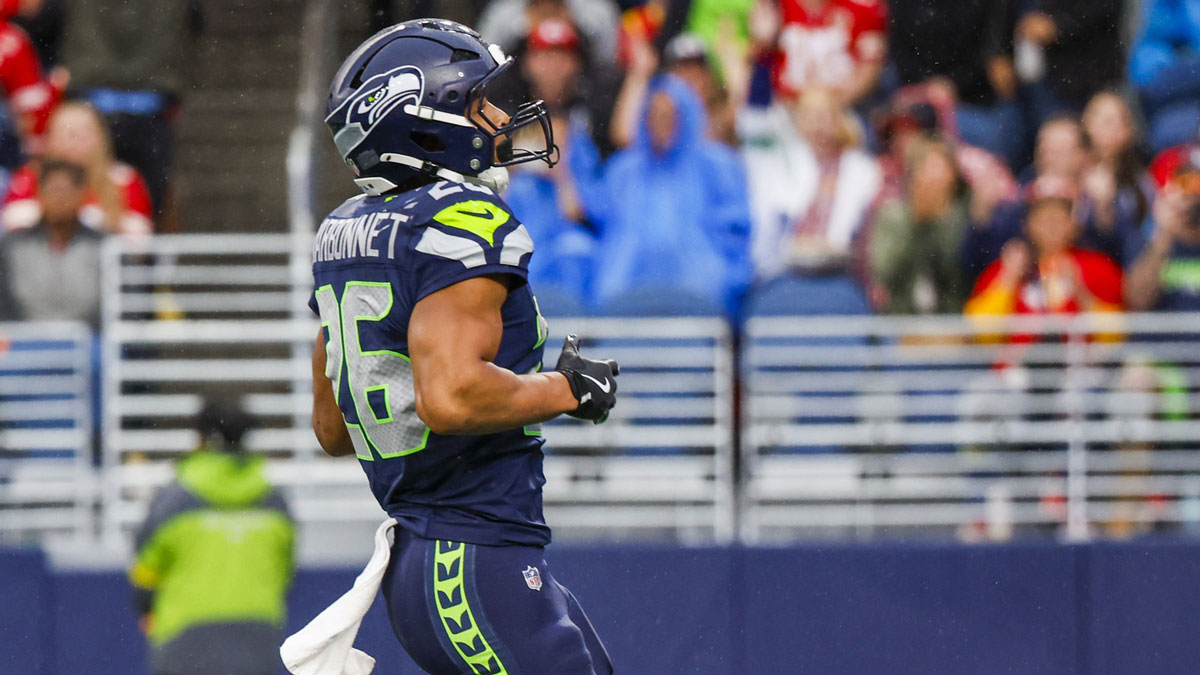 Seattle Seahawks running back Zach Charbonnet (26) rushes for a touchdown against the Kansas City Chiefs during the first quarter at Lumen Field.