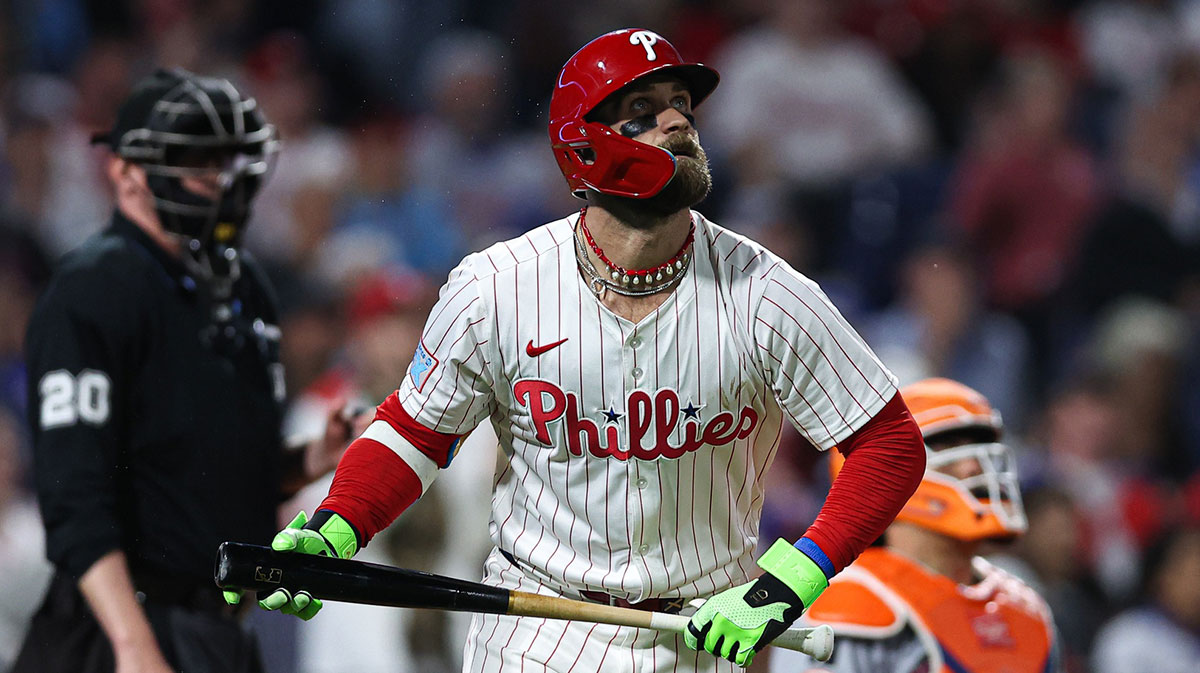 Philadelphia Phillies first base Bryce Harper (3) watches his ball clear the wall for a home run against the New York Mets during the seventh inning at Citizens Bank Park. Mandatory Credit: Bill Streicher-Imagn Images
