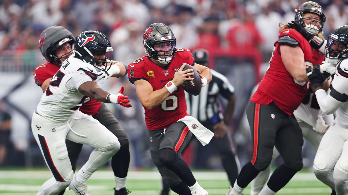 Tampa Bay Buccaneers quarterback Baker Mayfield (6) evades pressure and looks to pass during the first quarter against the Houston Texans at NRG Stadium.