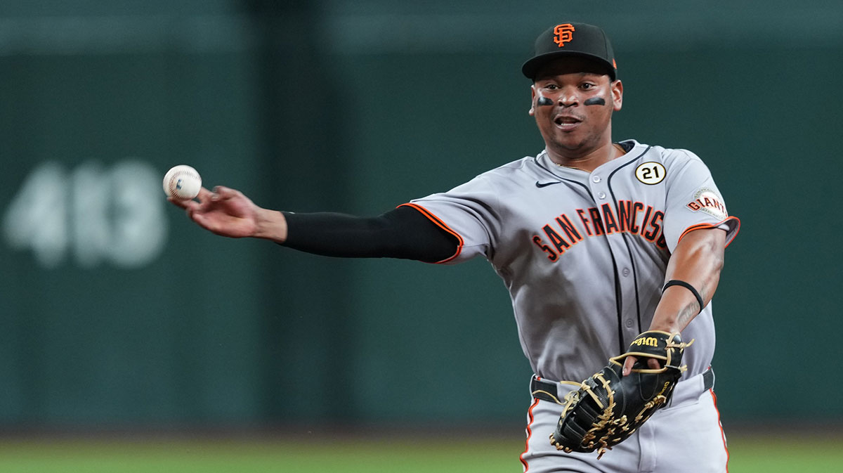 San Francisco Giants first baseman Rafael Devers (16) throws to first base against the Arizona Diamondbacks during the fourth inning at Chase Field.