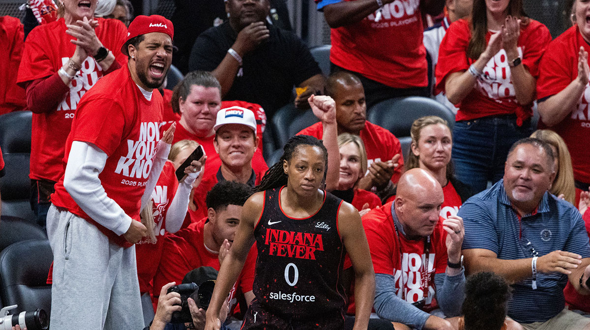Indiana Fever guard Kelsey Mitchell (0) celebrates a made basket with Indiana Pacers guard Tyrese Haliburton (0) during game two of round one against the Atlanta Dream for the 2025 WNBA Playoffs at Gainbridge Fieldhouse.