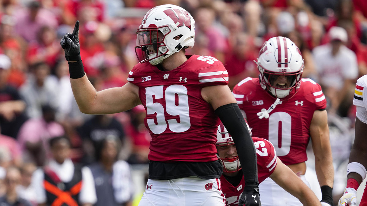 Wisconsin Badgers linebacker Aaron Witt (59) celebrates following a tackle during the second quarter against the Maryland Terrapins at Camp Randall Stadium.