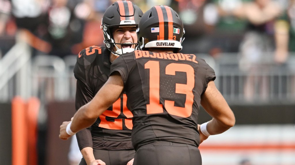 Cleveland Browns place kicker Andre Szmyt (25) and holder Corey Bojorquez (13) celebrate after Szmyt made a 55 yard field goal as time expired to beat the Green Bay Packers at Huntington Bank Field.