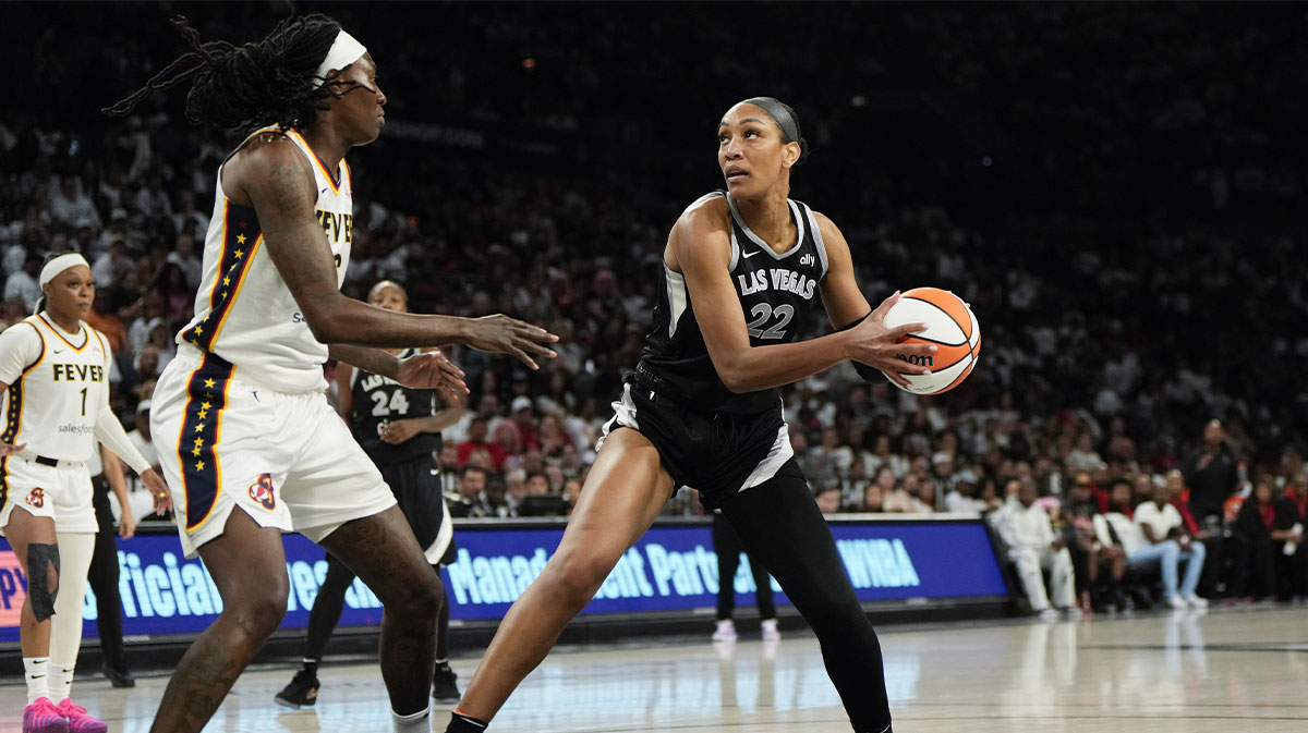 Las Vegas Aces center A'ja Wilson (22) controls the ball against Indiana Fever forward Natasha Howard (6) during the third quarter in game one of the second round for the 2025 WNBA Playoffs at Michelob Ultra Arena.