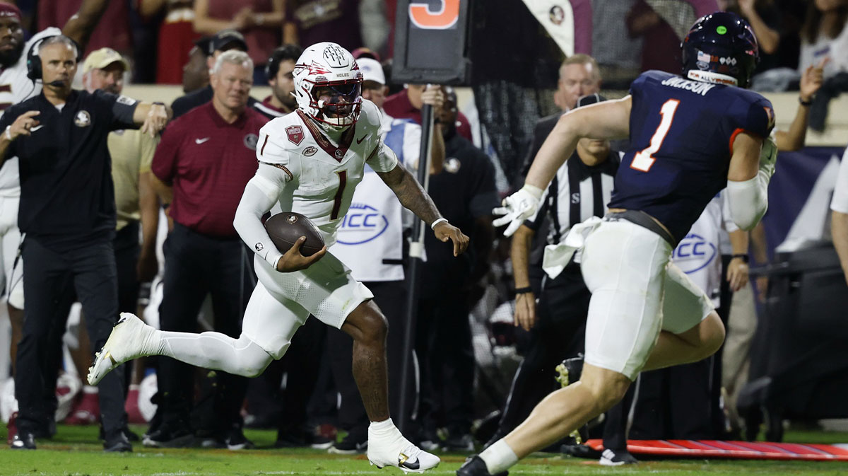 Florida State Seminoles quarterback Tommy Castellanos (1) runs with the ball as Virginia Cavaliers linebacker James Jackson (1) chases during the second quarter at Scott Stadium.