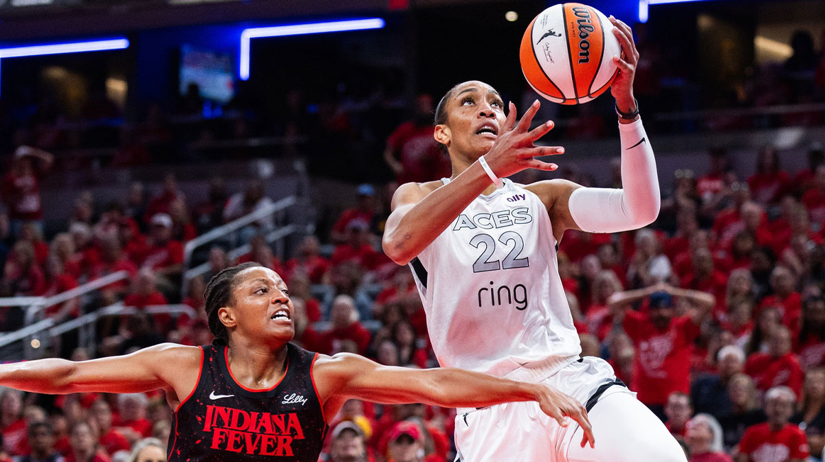 Las Vegas Aces center A'ja Wilson (22) shoots the ball while Indiana Fever guard Kelsey Mitchell (0) defends in the second half during game four of the second round for the 2025 WNBA Playoffs at Gainbridge Fieldhouse.